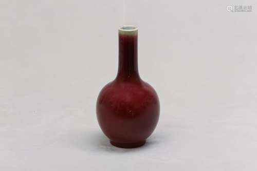 A CHINESE OX BLOOD-GLAZED BOTTLE VASE. Qing Dynasty