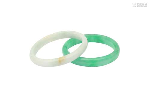 TWO CHINESE JADEITE BANGLES. The two bangles of semi-cylindr...