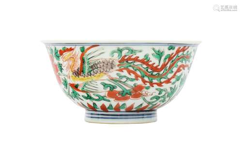 A CHINESE WUCAI 'PHOENIXES' BOWL. Late Ming Dynasty. The rou...