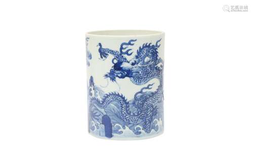 A CHINESE BLUE AND WHITE 'DRAGON AND CARP' BRUSH POT, BITONG...