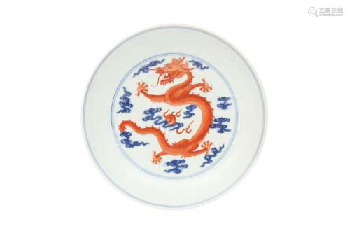 A CHINESE BLUE AND WHITE AND IRON-RED 'DRAGON' DISH. Qing Dy...
