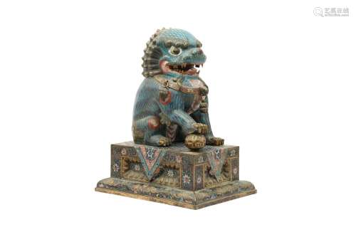 A CHINESE CLOISONNÉ ENAMEL MALE BUDDHIST LION DOG AND STAND....