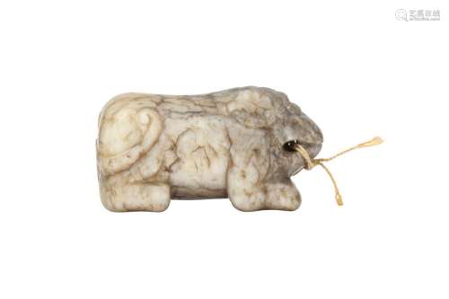 A CHINESE CHICKEN BONE JADE TIGER TALLY, HUFU. Carved as a c...