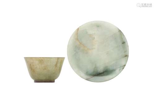 A CHINESE CELADON JADE CUP AND SAUCER. Qing Dynasty, Qianlon...