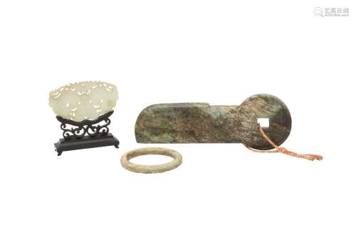 A CHINESE PALE CELADON JADE CHIME, A BANGLE AND A COIN CARVI...