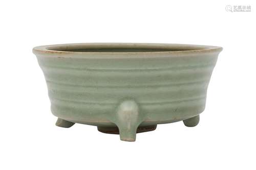 A CHINESE CELADON GLAZED TRIPOD CENSER. Song Dynasty. Of arc...