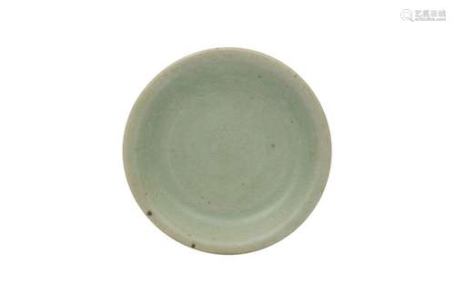 A CHINESE CELADON-GLAZED DISH. Song Dynasty. With an S-shape...