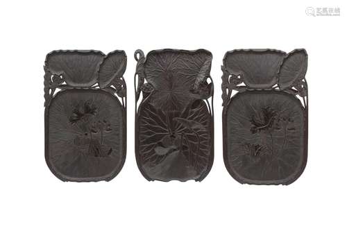 A SET OF THREE WOOD LOTUS TRAYS. 19th/20th Century. Carved a...