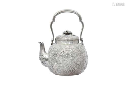 A JAPANESE REPOUSSÉ SILVER 'CHRYSANTHEMUM' TEAPOT AND COVER....