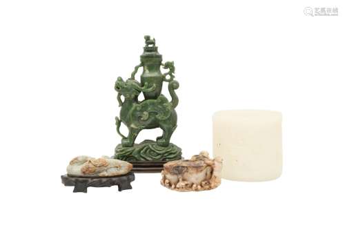 FOUR CHINESE JADE CARVINGS. Comprising a spinach-green 'qili...