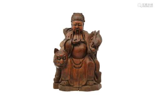 A CHINESE WOOD FIGURE OF THE GOD OF TREASURE. Late Qing Dyna...