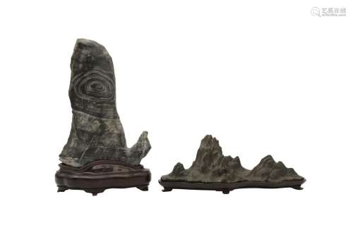 TWO CHINESE SCHOLAR'S ROCKS. The first of dark pewter-grey c...