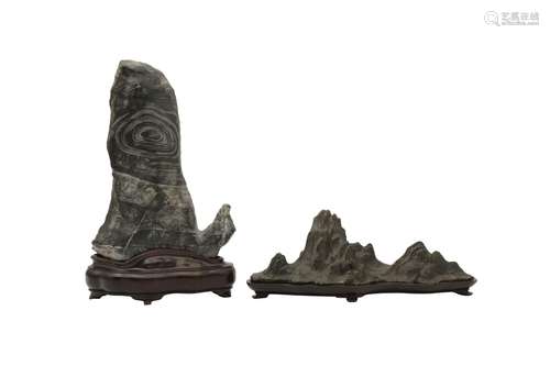 TWO CHINESE SCHOLAR'S ROCKS. The first of dark pewter-grey c...