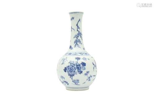 A CHINESE BLUE AND WHITE 'BLOSSOMS' BOTTLE VASE. The globula...