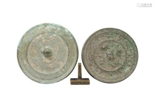 TWO CHINESE BRONZE MIRRORS AND A BRONZE SEAL. The square sea...