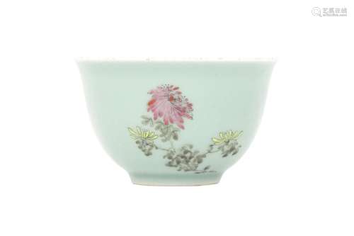 A CHINESE FAMILLE ROSE CELADON-GROUND BOWL. The rounded body...