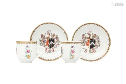 A PAIR OF CHINESE FAMILLE ROSE ARMORIAL CUPS AND SAUCERS. Qi...