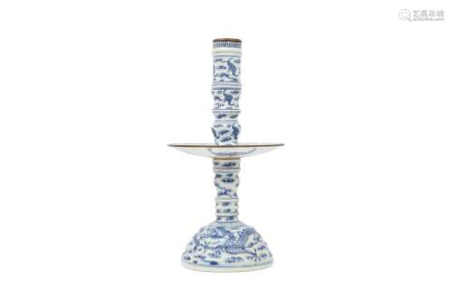 A CHINESE BLUE AND WHITE SECTIONAL 'DRAGON' CANDLE STICK. Qi...