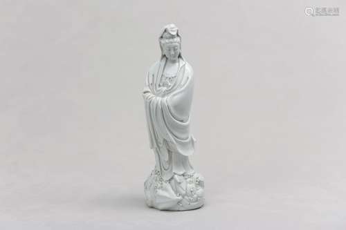 A CHINESE BLANC-DE-CHINE FIGURE OF GUANYIN. Standing in long...