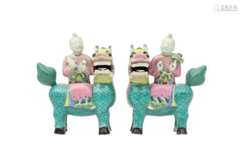 A PAIR OF CHINESE FAMILLE ROSE FIGURES RIDING QILIN. Qing Dy...