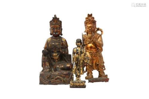 THREE CHINESE GILT FIGURES. Qing Dynasty and later. Comprisi...