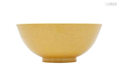 A CHINESE YELLOW-GROUND 'DRAGON' BOWL. The rounded body supp...