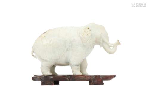 A CHINESE JADEITE CARVING OF AN ELEPHANT. Naturalistically c...