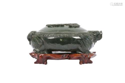 A CHINESE SPINACH-GREEN JADE 'DRAGON' VESSEL AND COVER. The ...
