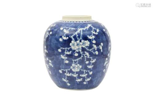 A CHINESE BLUE AND WHITE 'PRUNUS' JAR. With an ovoid body an...