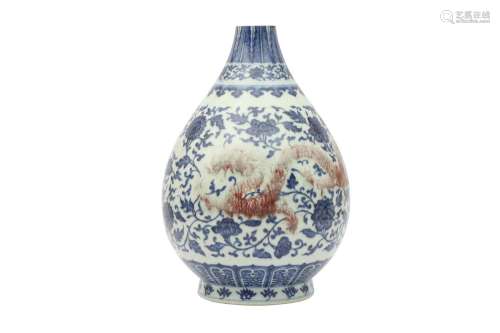 A CHINESE BLUE AND WHITE AND UNDERGLAZE RED 'DRAGON' VASE. T...