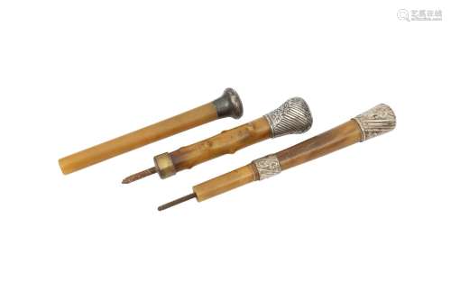 λ THREE RHINOCEROS WALKING STICK HANDLES. Circa 1900. Each w...