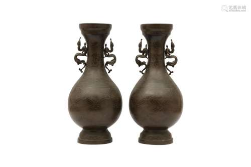 A PAIR OF VIETNAMESE SILVER-INLAID VASES. Each with a pear-s...