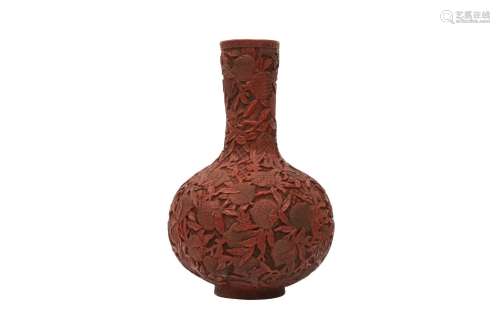 A CHINESE CINNABAR LACQUER STYLE 'PEACHES' BOTTLE VASE. The ...