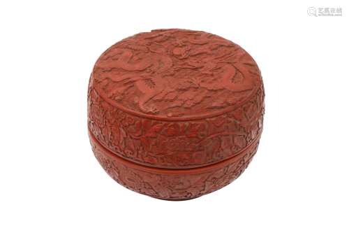 A CHINESE CINNABAR LACQUER STYLE 'DRAGON' BOX AND COVER. The...
