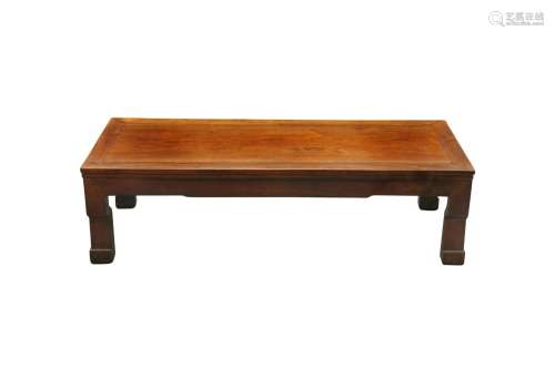 A CHINESE LOW HARDWOOD TABLE. With a rectangular top resting...