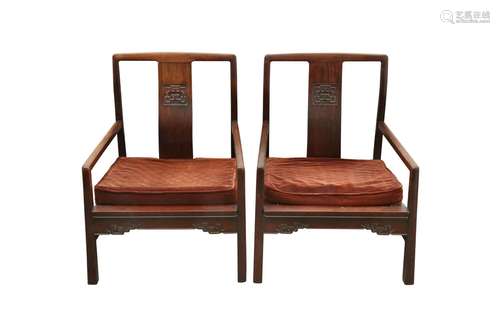 A PAIR OF CHINESE WOOD CHAIRS. Each with angular armrests an...