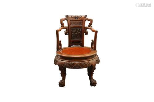 A CHINESE CARVED WOOD CHAIR. 19th / 20th Century. The circul...