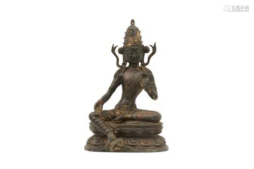 A GILT-BRONZE FIGURE OF AVALOKITESHVARA. Seated on a double ...