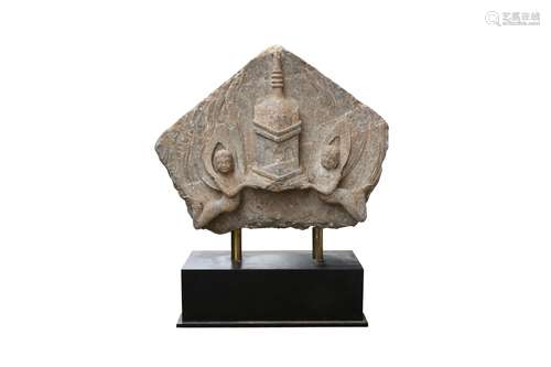 A CHINESE STONE TYMPANON. Of triangular form