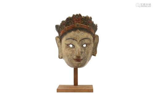 A LARGE POLYCHROMED MASK OF A BODHISATTVA. 19th Century. Car...