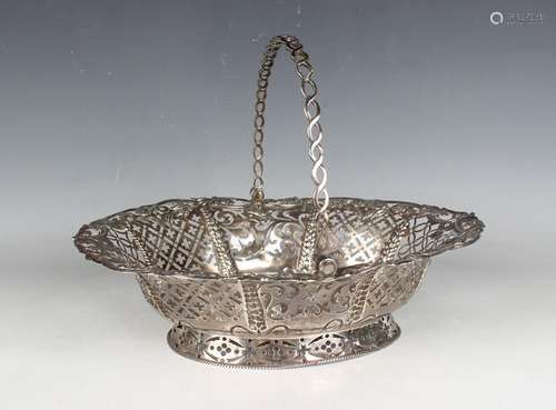 A George III silver oval bread basket with pierced swing han...