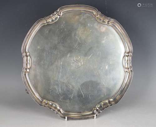 A George VI silver circular salver with raised lobed rim