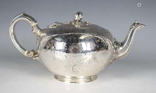 A Victorian silver circular teapot and cover with fruit fini...