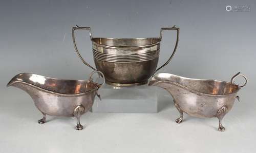 A George V silver two-handled sugar bowl of oval form with r...