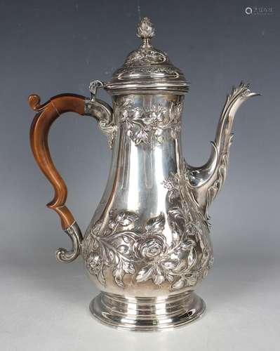 A George III silver coffee pot of baluster form with domed h...