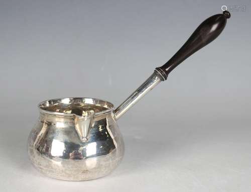 An early George II silver brandy pan of squat circular form ...