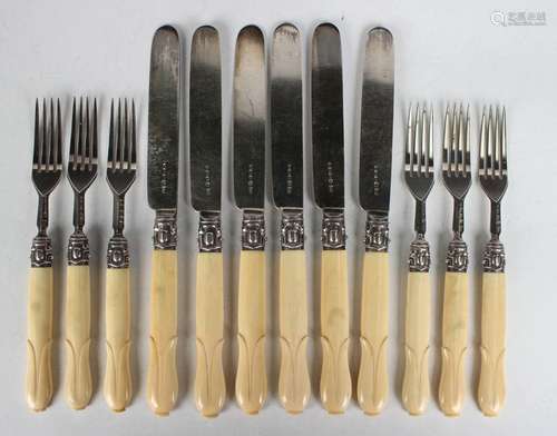 A set of six Victorian silver and ivory handled fruit knives...