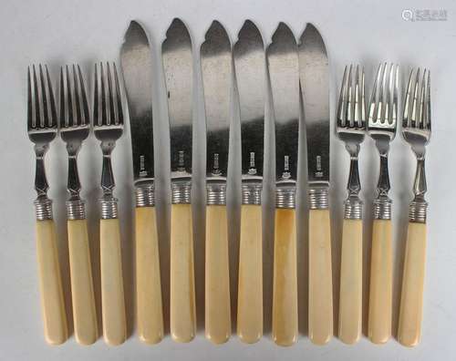 A set of six Edwardian silver and ivory handled fish knives ...