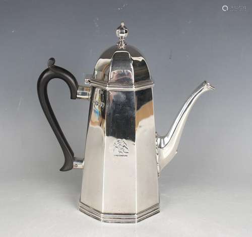 A late Victorian silver coffee pot of tapering octagonal for...