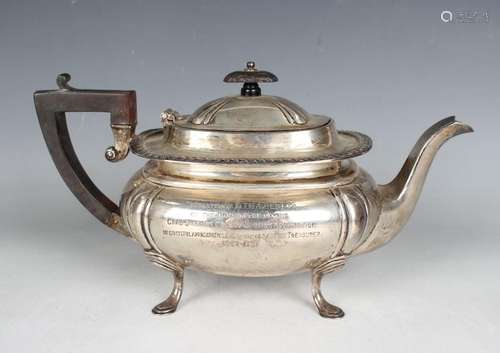 A George V silver cushion shaped teapot with gadrooned rim a...